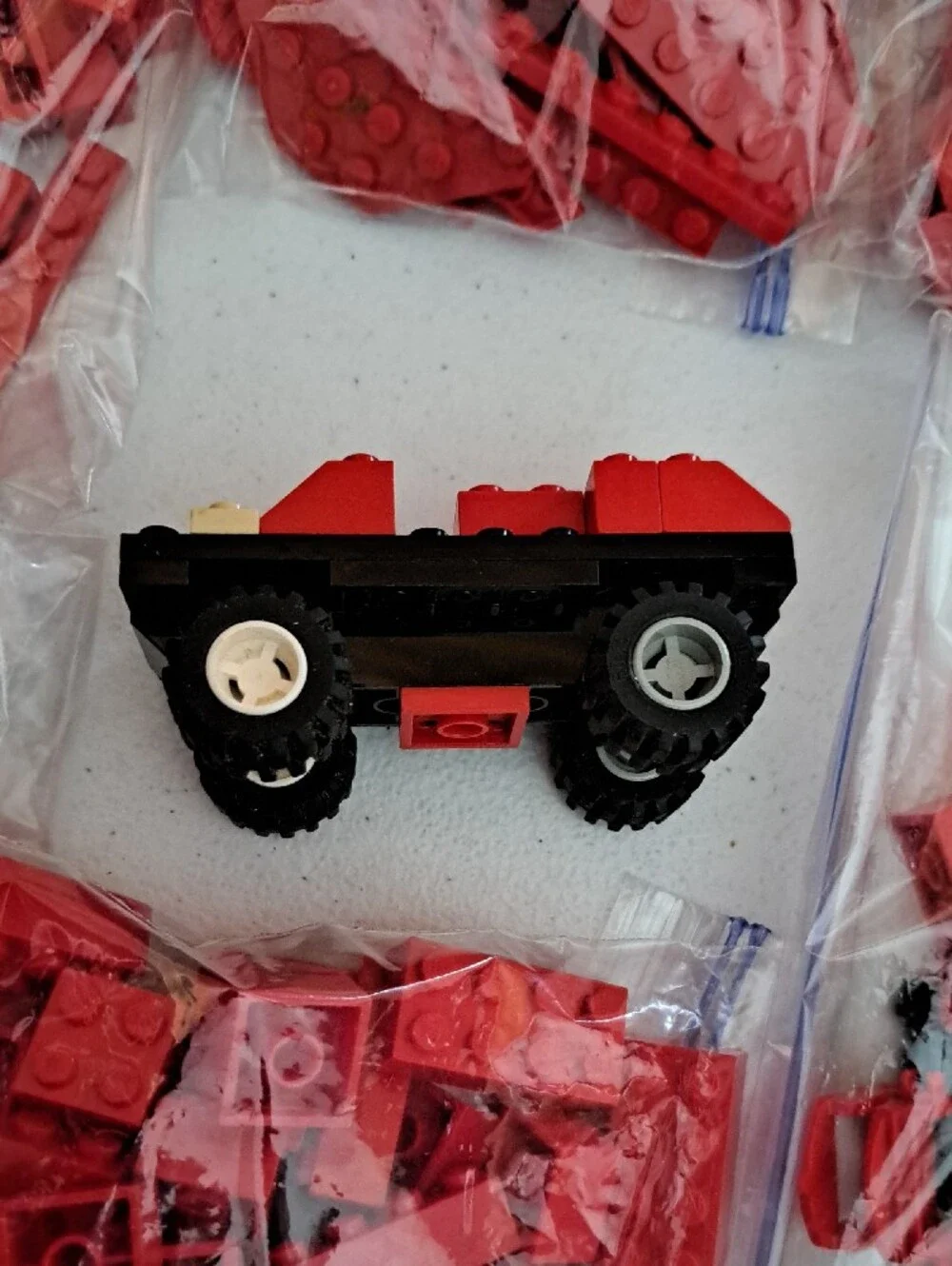 Loose Red Building Bricks Lot with Small Toy Vehicle